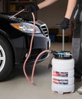 Pro Grade 9.5 Liter Fluid Extractor Pump With Pneumatic Manual Switch and Iron Clad No Drip Seal for Swift Oil Swaps on cars trucks boats lawnmowers in use.