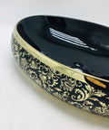 This Sleek Oval Ceramic Vessel Sink Totally Kicks Up Your Bath Game With A Premium Matte Gold Countertop Basin. Black and gold design.