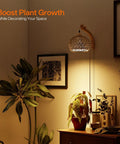 Go-To Rattan Hanging Grow Light For Indoor Plant Parents, 3800K Warm White illuminating potted houseplants on a wooden side table.