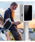 Bulletproof Ev Charger Pedestal For Commercial Sites Floor Mounted Electric Vehicle Charging Pillar With Secure Mechanical Lock Indoor Outdoor Weather Resistant Steel Enclosure in use by a man.