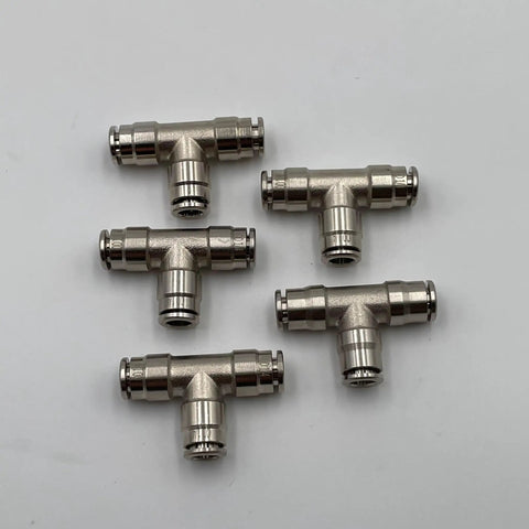 Five brass 1/4-inch push-to-connect air line tee fittings arranged in a cluster, suitable for high pressure systems.