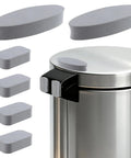 Six grey adhesive bumper pads for trash cans; wall protection shown on a stainless steel bin.