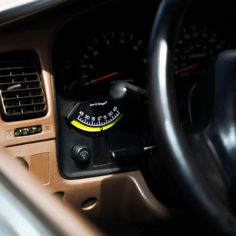 Installed 201-F Lev-O-Gage Inclinometer High Visibility Level Gauge in vehicle dashboard, showing easy-to-read tilt indicator