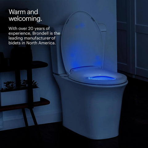 Premium Heated Elongated Toilet Seat With Built In Led Nightlight And Three Warmth Settings glowing in dim bathroom.