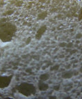 Close-up view of expansive foam texture of Tough As Nails Expanding Spray Foam Insulation Sealant for Large Gaps And Cracks.