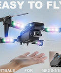 1080P HD Camera Foldable Mini FPV Drone with LED lights, hovering above a hand, showcasing easy flight and compact design.