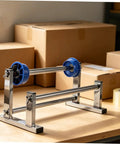Manual Film Roll Holder For Cargo Wrapping, Lightweight Metal Plastic Unwinding Frame, Hand Operated Dispenser For Warehouse Storage, Stable, Easy Reel Changes, Keeps Wrapping Tight And Cargo Secure Through Heavy Packing. Blue reel holder on tabletop