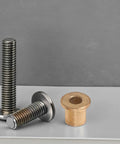 Six Piece Flanged Copper Sleeve Bearings With Step Shoulder Flange And Wrapped Brass Bushings Built Like A Tank For Heavy Equipment Workshops And Slick High Speed Motor Shafts displayed with steel bolts.