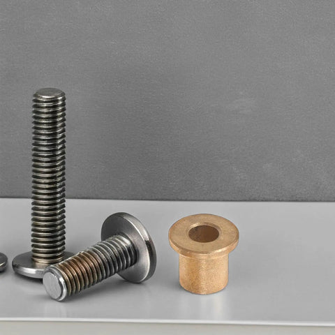 Six Piece Flanged Copper Sleeve Bearings With Step Shoulder Flange And Wrapped Brass Bushings Built Like A Tank For Heavy Equipment Workshops And Slick High Speed Motor Shafts displayed with steel bolts.