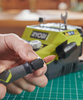 Badass 18 Volt Cordless Mini Rotary Tool With 35 Premium Accessories For Ultra Fast Diy Engraving Polishing And Precision Sanding Projects A Top Shelf Pick For Any Weekend Warrior Crafting Kit in use, showing tool attachment change.