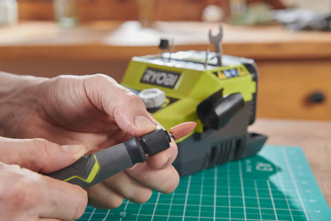 Badass 18 Volt Cordless Mini Rotary Tool With 35 Premium Accessories For Ultra Fast Diy Engraving Polishing And Precision Sanding Projects A Top Shelf Pick For Any Weekend Warrior Crafting Kit in use, showing tool attachment change.