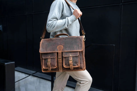 Person carrying Premium Buffalo Leather 18 Inch Laptop Messenger Bag For Men And Women Dope Satchel Office Briefcase with YKK Zippers