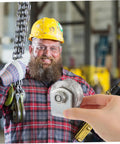 Worker holding 4-inch V-groove gate wheel in industrial setting