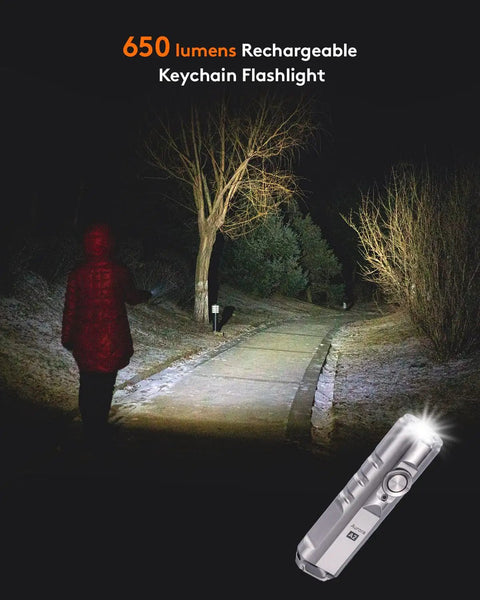 650 Lumens USB Rechargeable Keychain Flashlight illuminating a dark path, highlighting its outdoor use and ultra-brightness.