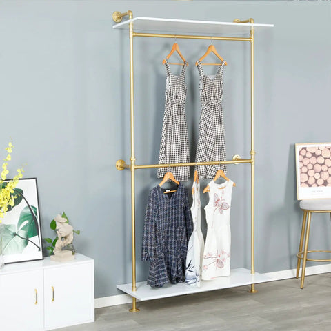 Hella Sturdy Two Tier Industrial Garment Rack With Thick Wood Shelf And Durable Metal Frame Wall Mounted displaying hanging dresses.