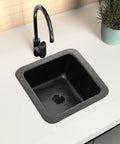 Glasgow 12-Inch Dual Mount Bar Prep Sink Hand Hammered Matte Black Aluminum Drop-In Or Undermount Kitchen Sink With Decorative Single Dual Mount Bowl Built To Last For Everyday Use installed in a white countertop.