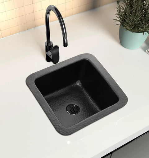 Glasgow 12-Inch Dual Mount Bar Prep Sink Hand Hammered Matte Black Aluminum Drop-In Or Undermount Kitchen Sink With Decorative Single Dual Mount Bowl Built To Last For Everyday Use installed in a white countertop.