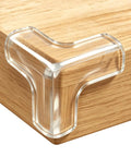 Tough As Nails Table Corner Guards 8 Pack Giant T Shaped Corner Protectors For Baby on wooden table edge.