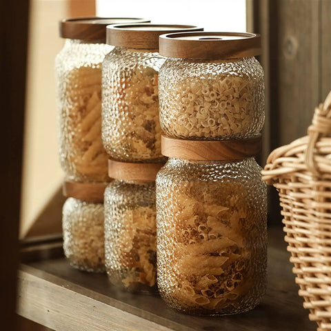 Premium Glass Coffee Canister With Secure Locking Lid Wide Mouth Kitchen Storage Jar For Beans Sugar Loose Tea Clear Airtight Food Container filled with pasta on a wooden shelf.
