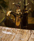 Top Shelf Rectangular Vessel Sink For Above Counter Bathroom Vanity Setup with modern gold faucet and marble edge.