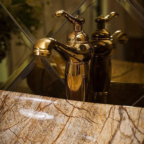 Top Shelf Rectangular Vessel Sink For Above Counter Bathroom Vanity Setup with modern gold faucet and marble edge.