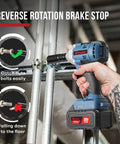 Person using Beefy Cordless Half Inch Brushless Impact Wrench With 300 Ft-Lb Torque, showing reverse rotation brake stop feature.