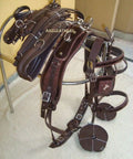 Nylon Horse Driving Harness with Patchwork Bridle, padded western bridle, and synthetic leather padding on display rack