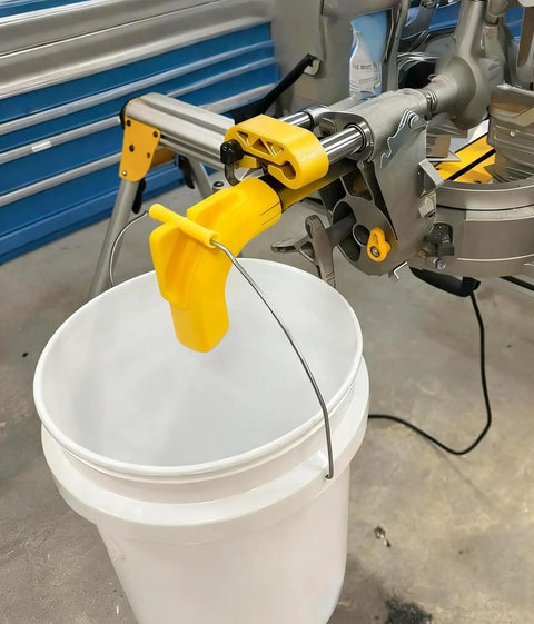 Keep Your Workshop Clean With This Dust Collector Kit For Miter Saw DWS780 No Vacuum Needed Attachment System That Uses A 5 Gallon Bucket Easy Install Mess Free Durable Yellow Sawdust Solution attached to miter saw
