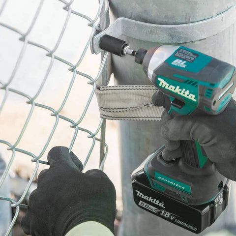 Beefy Impact Driver Socket Adapter Quarter Inch Square Drive Two Inch Length With Rock Solid Retention Ball in use on fence