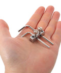 Hand holding Double Locking Tremolo Wrench Holder Kit For Guitar, Metal Headstock Mount With Hex Key Access tools.