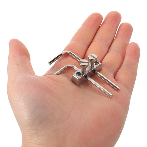Hand holding Double Locking Tremolo Wrench Holder Kit For Guitar, Metal Headstock Mount With Hex Key Access tools.