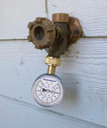 Blue Steel 2-1/2 Inch Water Pressure Gauge 0-200 PSI With 3/4 Inch Hose Thread attached to outdoor tap
