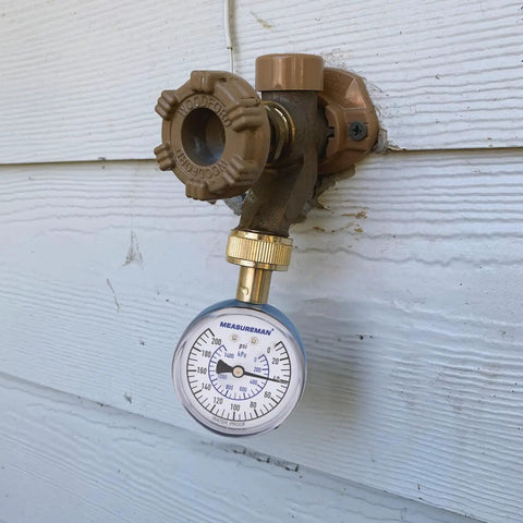 Blue Steel 2-1/2 Inch Water Pressure Gauge 0-200 PSI With 3/4 Inch Hose Thread attached to outdoor tap