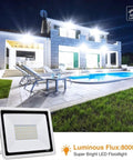 JUDYSSY Outdoor 100W Led Outdoor Flood Light, Security Light 3 Color Changing, 100w,1 Pack，100w-10 Pack，100w-10 Pack illuminating a pool area at night.