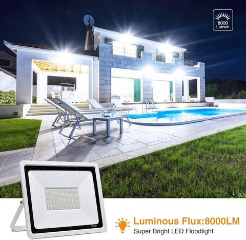 JUDYSSY Outdoor 100W Led Outdoor Flood Light, Security Light 3 Color Changing, 100w,1 Pack，100w-10 Pack，100w-10 Pack illuminating a pool area at night.