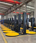 Automatic Pallet Stretch Wrapping Machine With Advanced Plc Interface Engineered As A Heavy Duty Industrial Shrink Wrap Workhorse And Total Warehouse Game Changer in a factory with multiple machines.