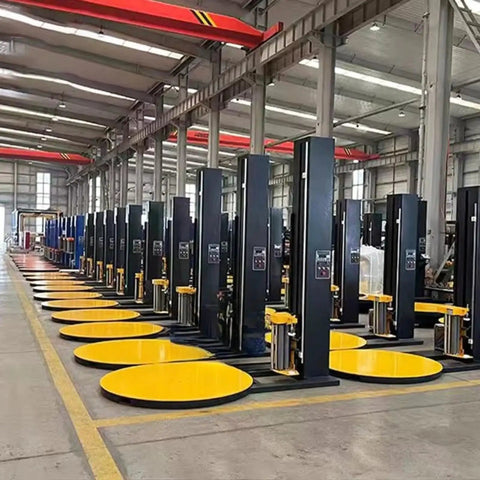 Automatic Pallet Stretch Wrapping Machine With Advanced Plc Interface Engineered As A Heavy Duty Industrial Shrink Wrap Workhorse And Total Warehouse Game Changer in a factory with multiple machines.