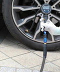 User inflating tire with Straight Shooter Hybrid Air Compressor Hose 3/8 Inch By 3 Feet Lays Flat Kink Free Rubber Pvc Build.