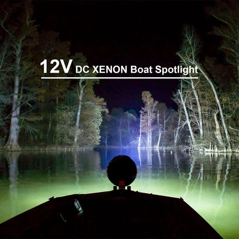 Boat on a lake using TacticPro 2000 Lumen HID Spotlight Floodlight For Auto, Garage, Boating, Fishing, Hunting, Camping, Hiking, Emergency And Patrolling Your Go To Handheld Spotlight With Durable ABS Build And Rugged Rubber Grip illuminating trees