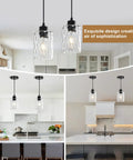 Two Pack Black Hammered Glass Pendant Lights With Adjustable Cords For Kitchen Island over a modern kitchen island.