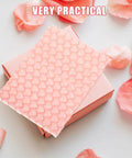 Pink Heart Shaped Bubble Mailers Pack 50 Lightweight Shockproof Envelopes for Jewelry on pink box with petals