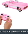 Remote Control Corvette Toy Car From Barbie Movie with controller, pink design, and open front seats for two Barbie dolls.