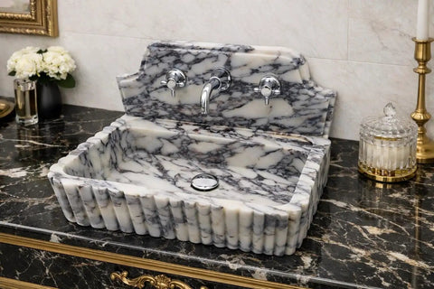 Straight Up Premium Calacatta Viola Marble Wall Mount Bathroom Sink with chrome faucet on elegant marble countertop.