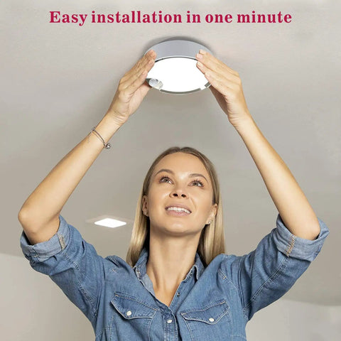 Person installing Battery Operated Motion Sensor Ceiling Light Wireless LED 7.4 Inch With All Day And Night Modes 300LM White Light