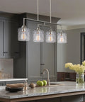 Monroe 28 Inch Modern Four Light Linear Kitchen Island Light With Hammered Glass Shades Brushed Nickel Finish over kitchen island