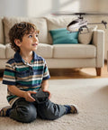 Child using Easy Start RC Helicopter For Beginners With Gyro 2.4GHz Remote OneKey Takeoff And Landing 4 Channel Flight indoors