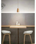 Wood LED Pendant Light Dining Room Furniture Hanging Light Restaurant Walnut Indoor Lights Beside GU10 LED above a wooden table.