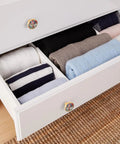 Open white dresser drawer with Birdhouse Fence Blue Dresser Drawer Knobs Set Of 4 With Screws Acrylic And Zinc Alloy Cabinet Pulls Easy Install Handles For Dressers Closet Door Knobs And Furniture 32mm, clothes inside.