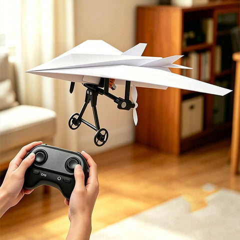 Hands controlling Electric Remote Control Paper Airplane Kit With Stabilizer And Dual Propellers for easy gliding indoors