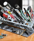 Desk Top Aluminum Alloy Screwdriver Rack And Tool Organizer With 45 Degree Tilt For Grab And Go Easy Access Double Layer Storage For Screwdrivers Pliers And Tweezers Anodized Aluminum Alloy Construction In Dark Gray Finish on desk with tools